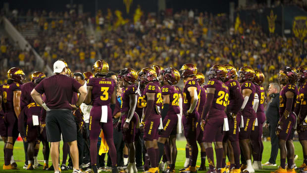 ASU team huddled